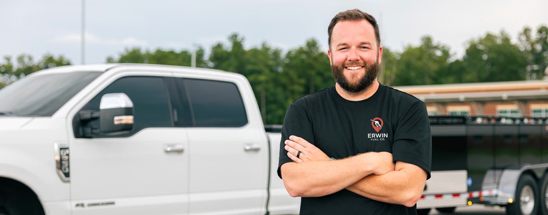 Erwin Fuel Co. truck delivering fuel to construction equipment on job site